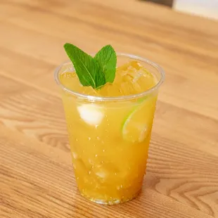 Mango lychee green tea made with fresh fruit puree, made in-house!