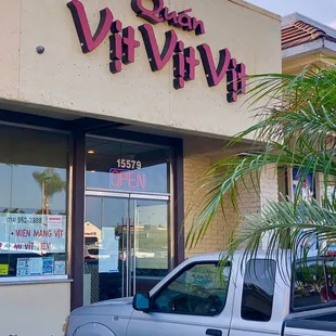 a truck parked outside a store