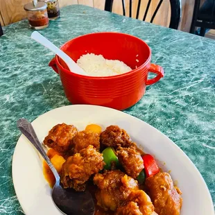 a plate of food and a bowl of rice