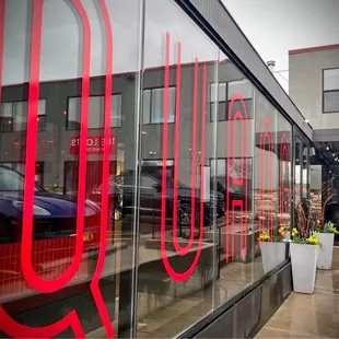 the reflection of the restaurant across the street