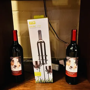 two bottles of wine on a shelf