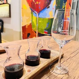 three glasses of wine on a cutting board