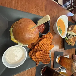 Single burger, sweet potato fries and tomato bisque.
