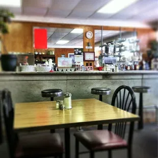 a table and chairs in a restaurant