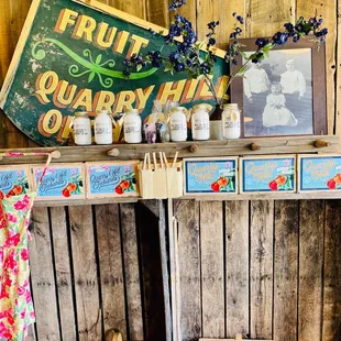 a fruit stand with jars and jars