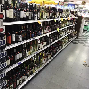 rows of beer bottles on shelves