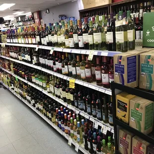 a wide selection of wines on shelves