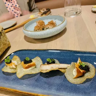 Fish on chips snack (for one- $5) smoked NZ kingfish, caviar, citrus mayo. In the background is the brassica balls with goat cheese snack