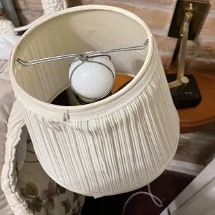Broken and old lampshade and arm