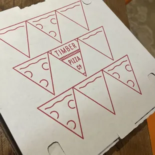 a pizza box on a table
