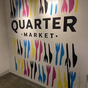 a wall with a colorful sign on it