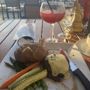 Filet mignon, baked potato and veggies