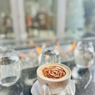 a cup of coffee on a table