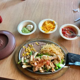 My chicken fajitas with rice and beans. Tortillas in the brown warmer. Generous supply of yummy chicken.