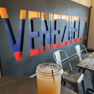 a drink in a glass on a table