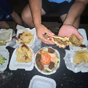 Yuca with chicharron Pupusa taco Revuelta tacos