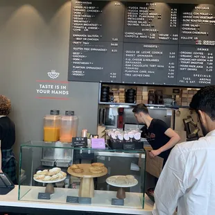 people ordering food at a counter