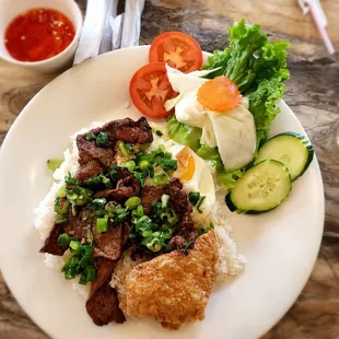 Com tam bo nuong (broken rice with lemon grass beef) with an egg and tau hu ky (fried shrimp paste)