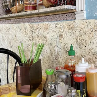 a table with condiments and condiments