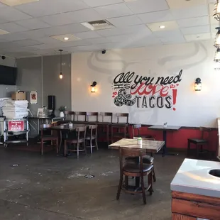 Inside - a few dining tables and bar