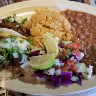 2 taco combo with beans, rice and cabbage  salad
