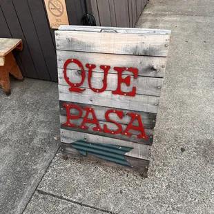 a sign on the sidewalk