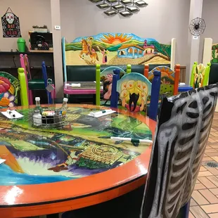 a brightly painted table and chairs