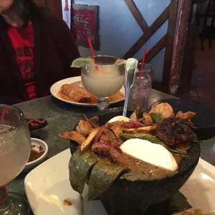 Molcajeté with Presidente Margarita in background.