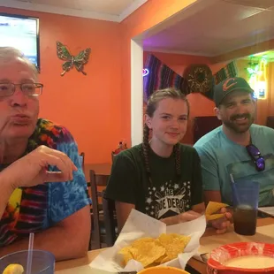 a group of people sitting at a table