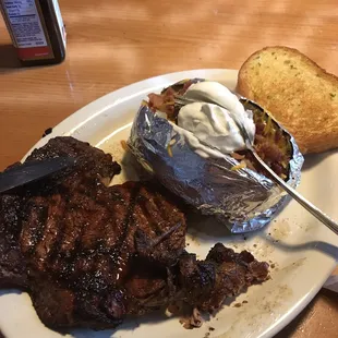 Steak and loaded baked potato.  The best steak in town at a very reasonable price!