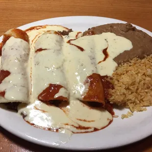 "Enchiladas" why the heck did they smother it in this white queso?? I had to scrape it off. Not good. Rice undercooked. Beans taste canned.