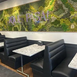 The sign inside over the booths.