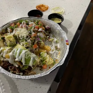 Carne asada fries are fire!!!!! Sorry but had to take some bites could not wait!