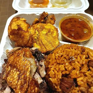 Pernil with crackling, house special rice with smoked ham, habichuelas (stewed beans), tostones with garlic mojo &amp; picante sauces