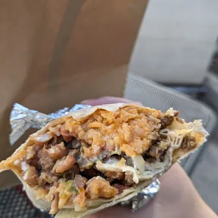 Steak super burrito with fried beans