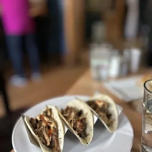 three tacos on a plate