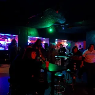 a group of people sitting at a bar