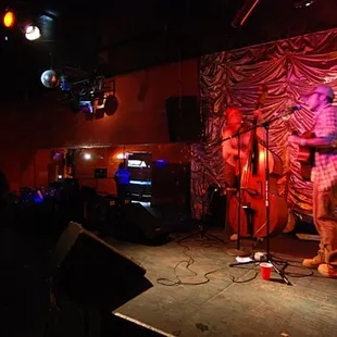 a man standing on a stage with a microphone
