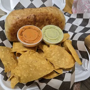 Burrito and chips with hotsauce