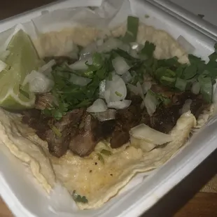 Carnita taco with cilantro and onion