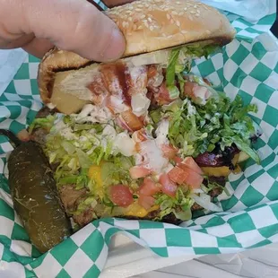 Tal burger. Very good. Cant see it but has a split sausage on there too.