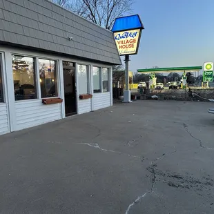 the outside of a restaurant with a sign for the restaurant