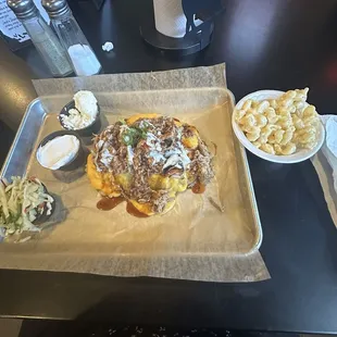 Potatoes with brisket and a side of mac and cheese