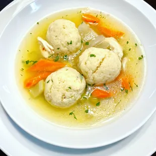 House-made chicken matzo ball soup! This family recipe of ours is the perfect comfort food.