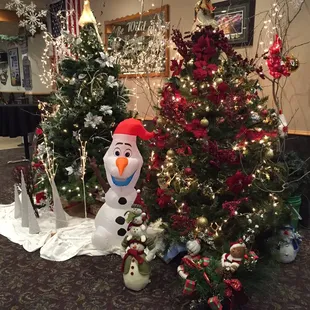 a snowman and christmas tree