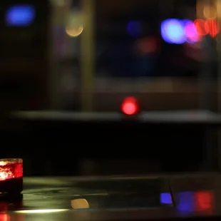a lit candle on a table