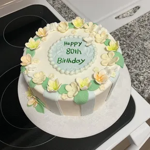 a birthday cake on a stovetop
