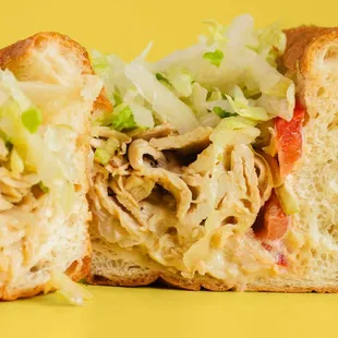 Chicken Cheesesteak Hoagie served with Grilled Chicken, Fried Onions, Melted Cheese, Lettuce, Tomato, and Mayo