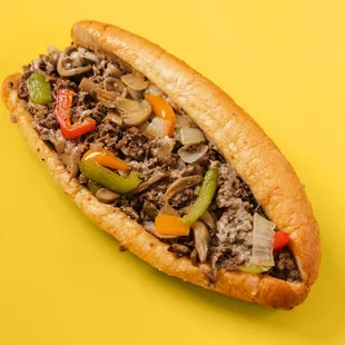 Deluxe Cheesesteak
Ribeye Steak, Grilled Onions, Mushrooms, Bell Peppers/Sweet Peppers, and your choice of cheese on a 10" Amoroso Roll.