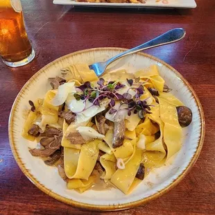 Beef stroganoff and my husband's already bitten buffalo chicken sandwich and fries